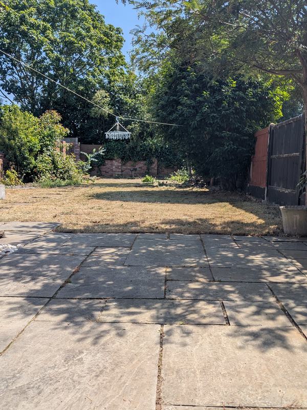 Cleared garden with a weeded patio and cut lawn