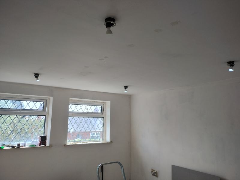 Ceiling with four downlights fitted and lamps in place