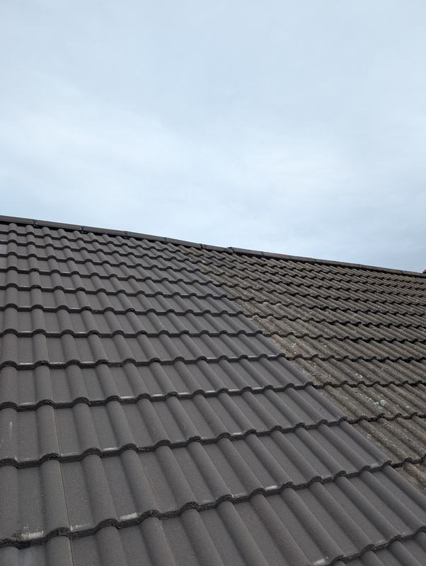 Tiled roof before the flue was fitted, with newer tiles on the left