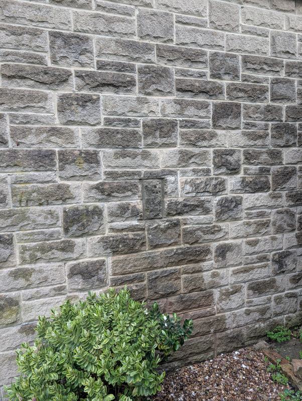 Stone wall with the vent opening filled in